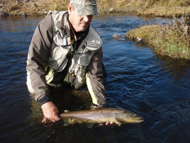 Richard holding a rainbow trout